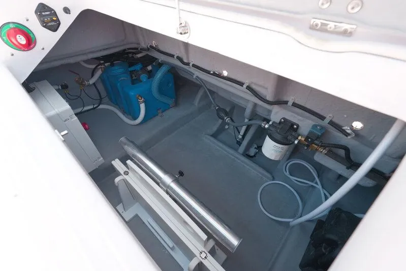  Yacht Photos Pics Engine compartment of 2025 Ranieri NEXT 255 LX boat, showcasing mechanical components and wiring.