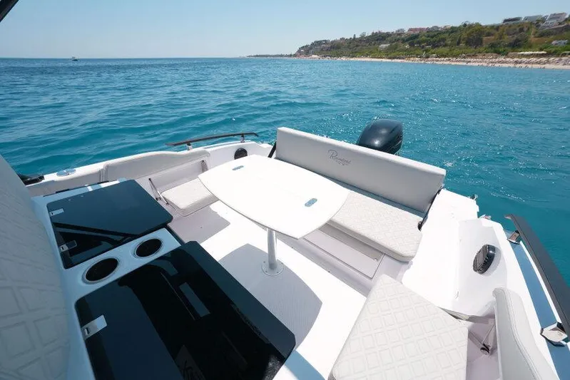  Yacht Photos Pics Luxury seating area on 2025 Ranieri NEXT 255 LX boat, overlooking serene ocean waters.