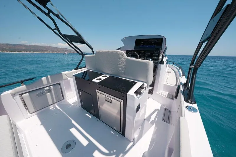  Yacht Photos Pics 2025 Ranieri NEXT 255 LX boat interior with modern helm and seating on open water.