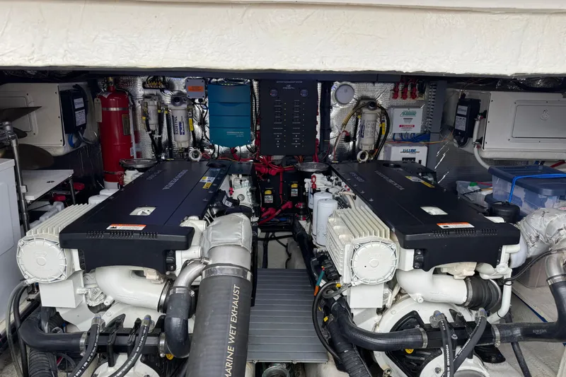 Blue Skies Yacht Photos Pics Engine room of 2017 Regal 42 Fly yacht, showcasing dual engines and equipment.