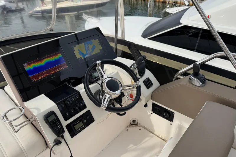 Blue Skies Yacht Photos Pics Cockpit of 2017 Regal 42 Fly yacht with advanced navigation displays and controls.