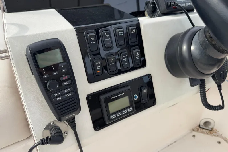 Blue Skies Yacht Photos Pics Control panel of a 2017 Regal 42 Fly yacht with radio and switches.