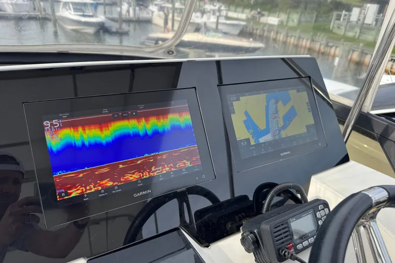 Blue Skies Yacht Photos Pics Garmin navigation displays on 2017 Regal 42 Fly yacht, showing sonar and map data.