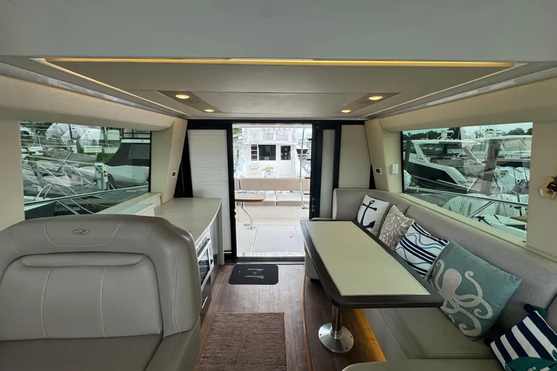 Blue Skies Yacht Photos Pics Luxurious interior of 2017 Regal 42 Fly yacht with elegant seating and nautical decor.