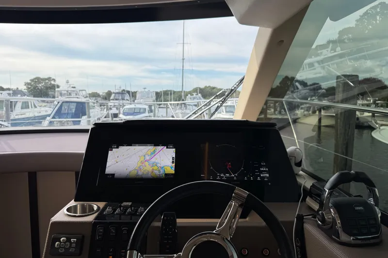 Blue Skies Yacht Photos Pics Interior view of 2017 Regal 42 Fly yacht cockpit with navigation display.