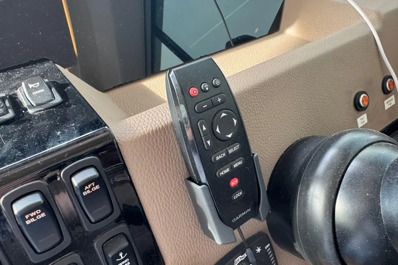 Blue Skies Yacht Photos Pics Control panel of a 2017 Regal 42 Fly yacht with Garmin remote.