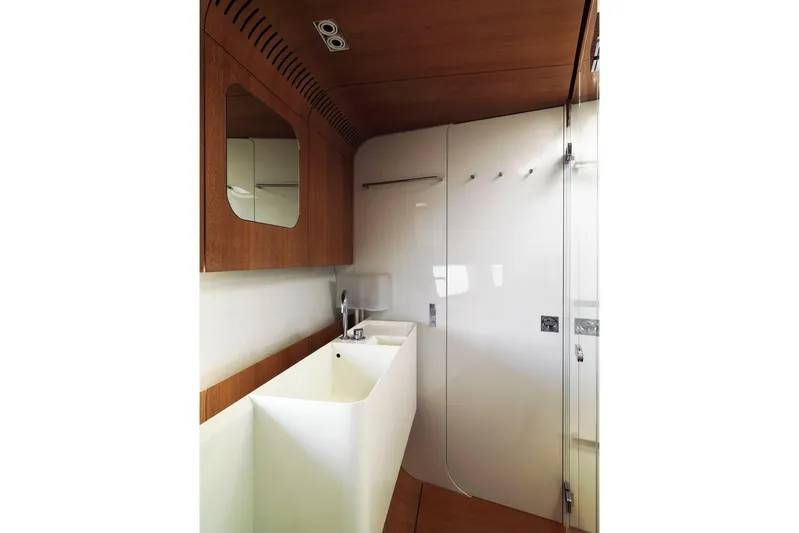 Polytropon II Yacht Photos Pics Luxurious bathroom interior of 2008 Nautor Swan 82 yacht with modern fixtures.