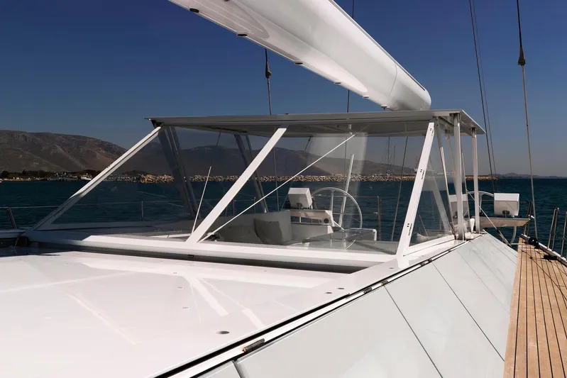 Polytropon II Yacht Photos Pics Nautor Swan 82 yacht deck, 2008 model, featuring sleek design and ocean backdrop.