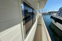 2011 Beneteau Swift Trawler 52 side deck with marina view.