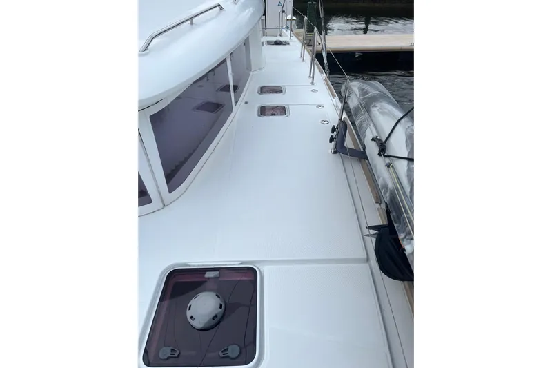 "lagu" Yacht Photos Pics Deck view of 2011 Lagoon 450 catamaran, showcasing sleek design and spacious layout.