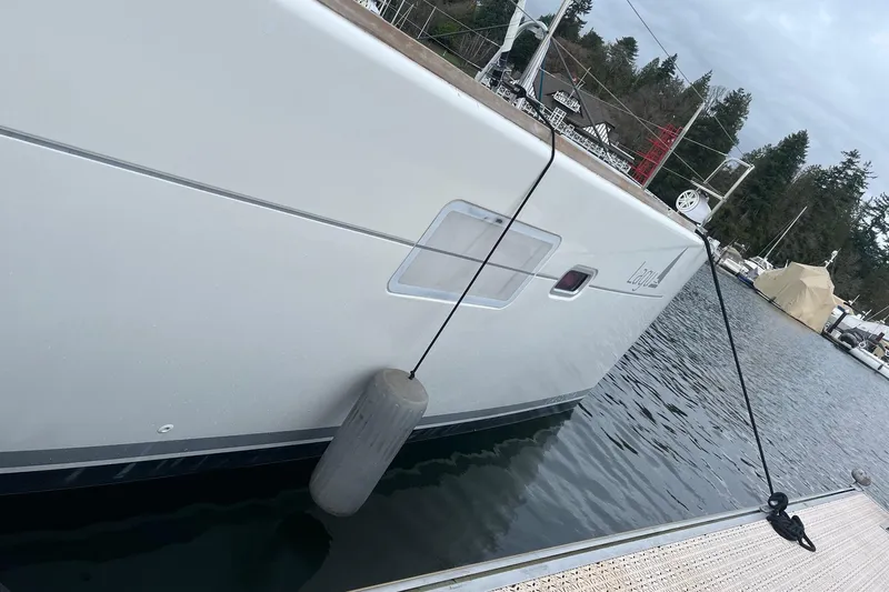 "lagu" Yacht Photos Pics 2011 Lagoon 450 catamaran docked at marina, side view with fender.