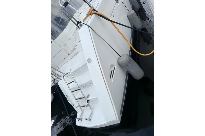 "lagu" Yacht Photos Pics Stern view of 2011 Lagoon 450 catamaran with ladder and dock fenders.