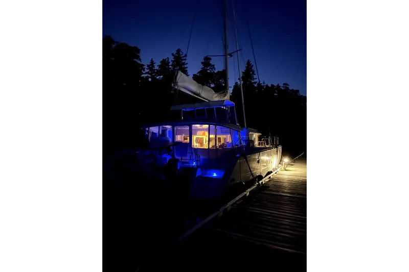 "lagu" Yacht Photos Pics Lagoon 450 catamaran, 2011 model, illuminated at night on a dock.