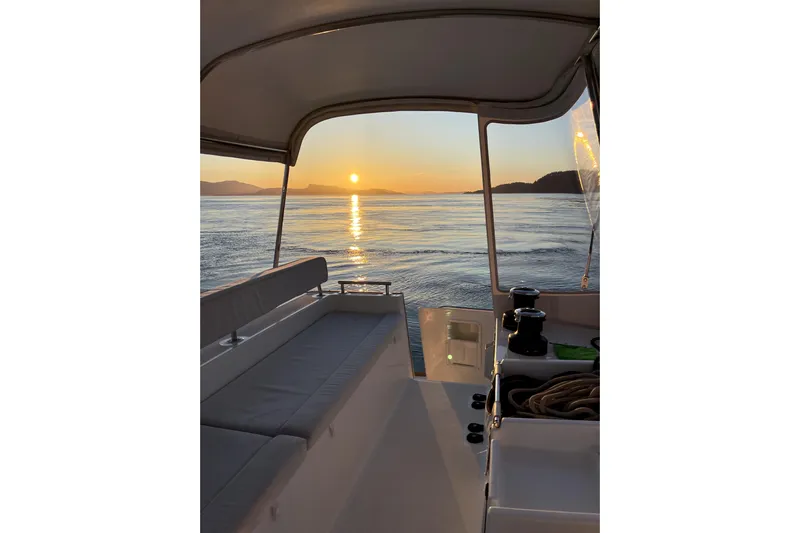 "lagu" Yacht Photos Pics Lagoon 450 catamaran at sunset, 2011 model, serene ocean view.