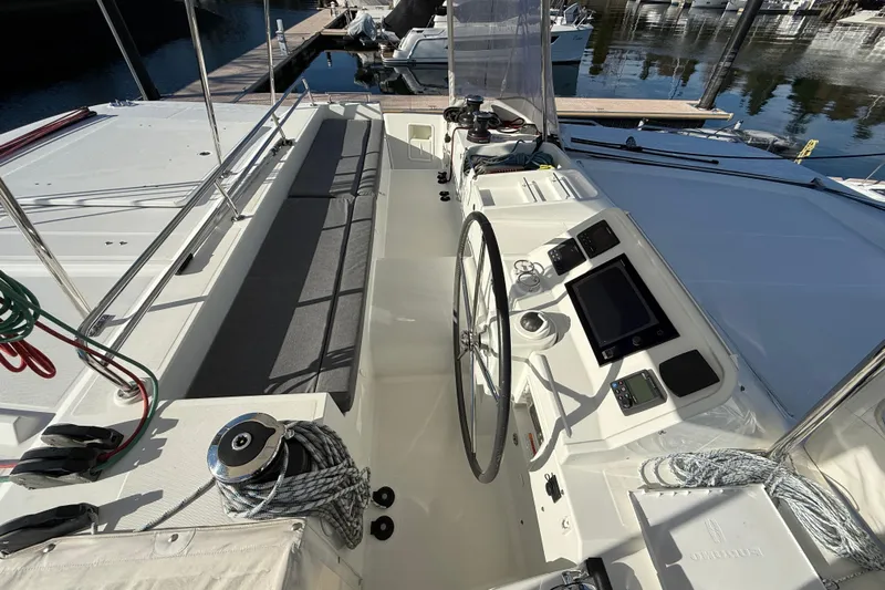 "lagu" Yacht Photos Pics Cockpit of 2012 Lagoon 450 catamaran with steering wheel and navigation instruments.