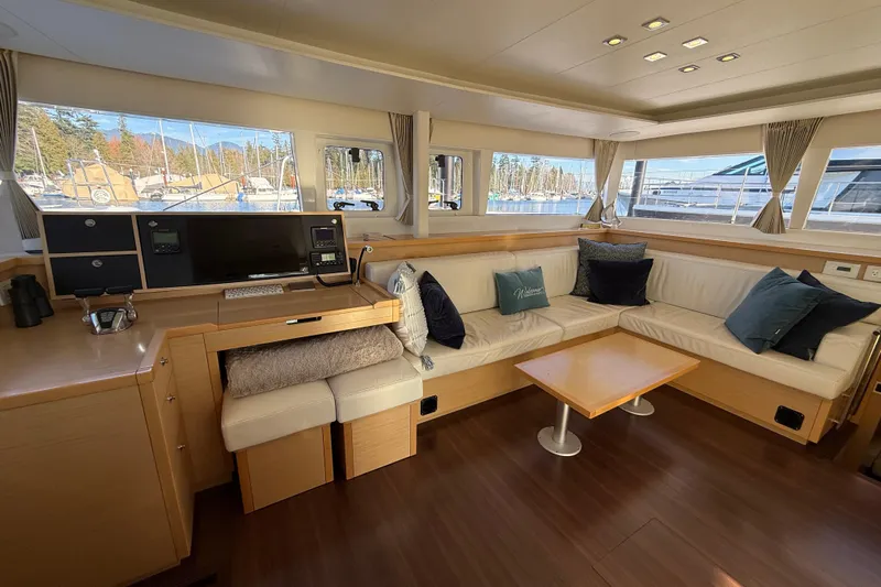 "lagu" Yacht Photos Pics Interior of 2012 Lagoon 450 yacht with cozy seating and modern navigation equipment.