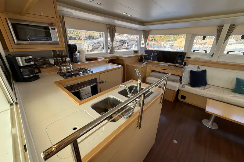 "lagu" Yacht Photos Pics Interior of 2012 Lagoon 450 catamaran with modern kitchen and cozy seating area.