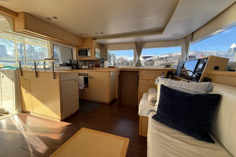 "lagu" Yacht Photos Pics Interior of 2012 Lagoon 450 catamaran with modern kitchen and cozy seating area.