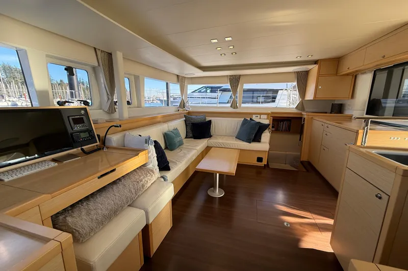 "lagu" Yacht Photos Pics Luxurious interior of 2012 Lagoon 450 catamaran with spacious seating and modern amenities.