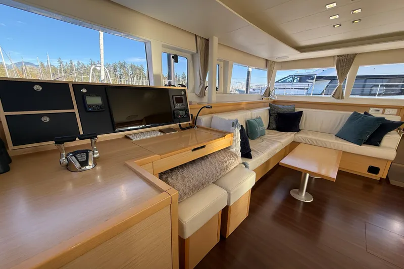 "lagu" Yacht Photos Pics Luxurious interior of 2012 Lagoon 450 yacht with modern seating and navigation area.