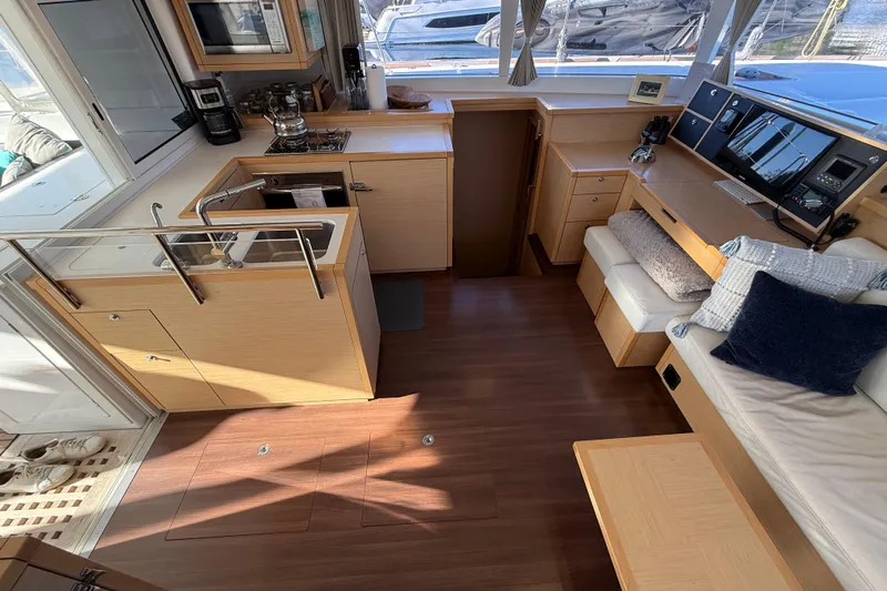 "lagu" Yacht Photos Pics Interior of 2012 Lagoon 450 catamaran with modern kitchen and cozy seating area.