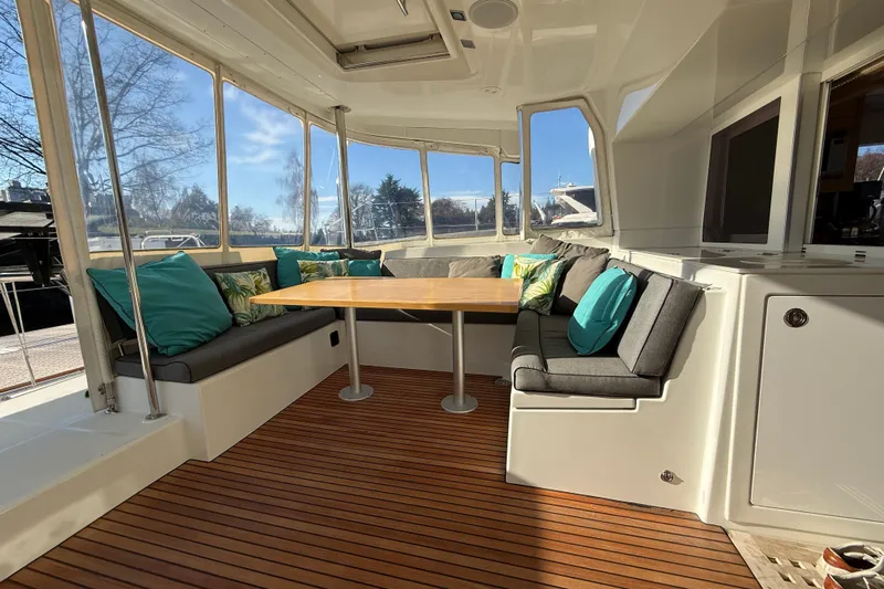 "lagu" Yacht Photos Pics Luxurious 2012 Lagoon 450 yacht interior with cozy seating and elegant wooden flooring.