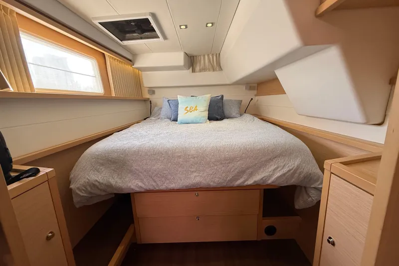 "lagu" Yacht Photos Pics Cozy bedroom in 2012 Lagoon 450 yacht with plush bedding and natural light.