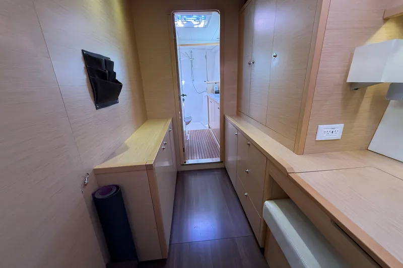 "lagu" Yacht Photos Pics Interior of 2012 Lagoon 450 yacht, featuring sleek wooden cabinetry and modern design.