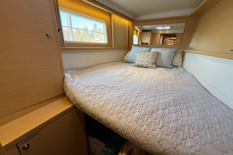 "lagu" Yacht Photos Pics Cozy bedroom interior of 2012 Lagoon 450 yacht with soft bedding and natural light.