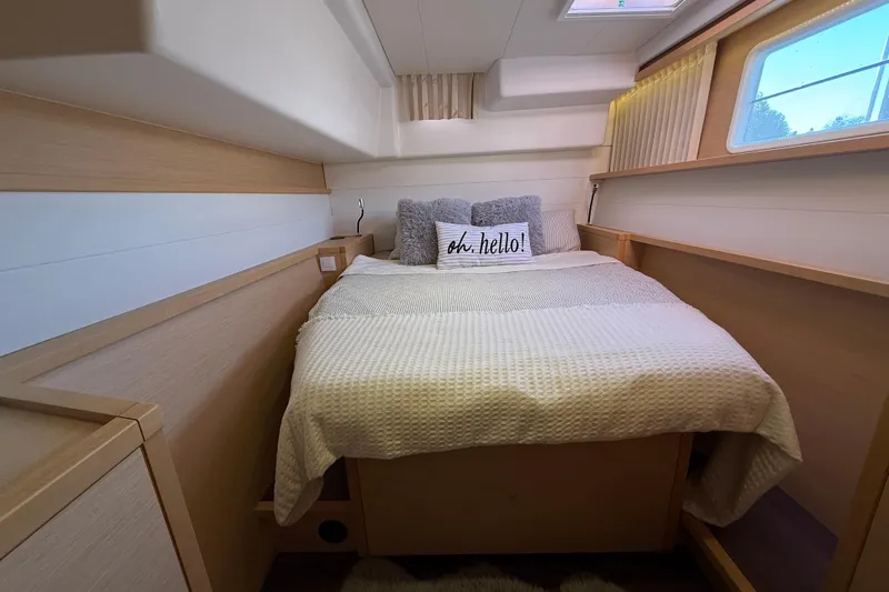 "lagu" Yacht Photos Pics Cozy bedroom interior of 2012 Lagoon 450 yacht with plush bedding and natural light.