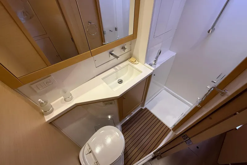 "lagu" Yacht Photos Pics Bathroom interior of 2012 Lagoon 450 yacht with modern fixtures and wooden accents.