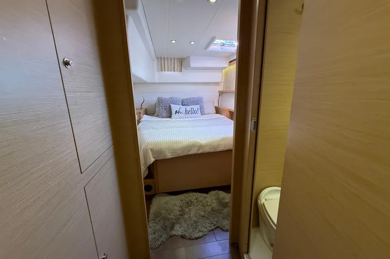 "lagu" Yacht Photos Pics Cozy bedroom in 2012 Lagoon 450 yacht with plush bedding and modern decor.