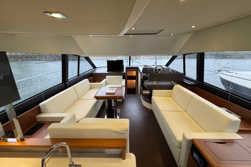  Yacht Photos Pics Luxurious interior of 2013 Prestige 500 yacht with elegant seating and panoramic windows.