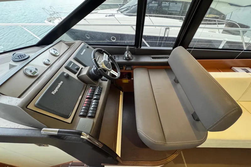  Yacht Photos Pics Helm of 2013 Prestige 500 yacht with Raymarine navigation system and comfortable seating.