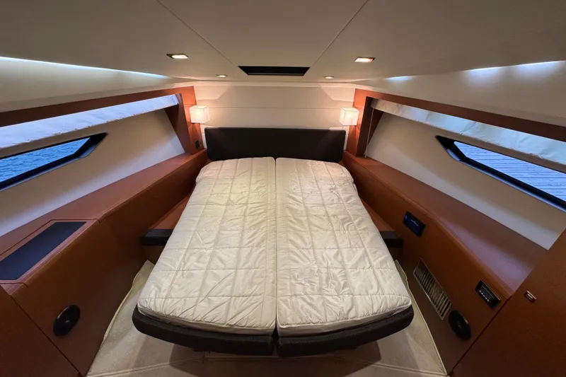  Yacht Photos Pics Luxurious cabin interior of 2013 Prestige 500 yacht with cozy bed and modern lighting.