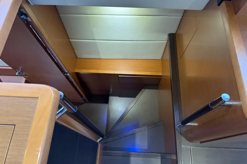  Yacht Photos Pics Staircase inside 2013 Prestige 500 yacht with wooden finish and modern design.