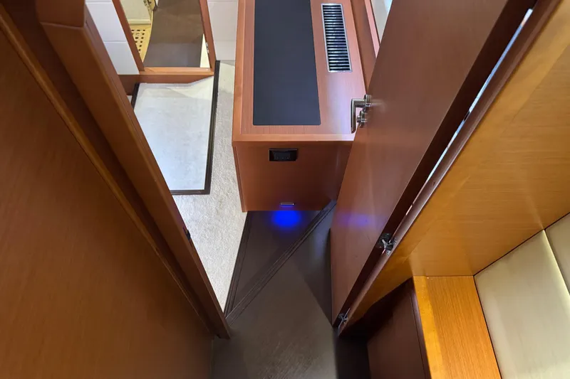  Yacht Photos Pics Interior view of a 2013 Prestige 500 yacht, featuring wooden cabinetry and modern design.