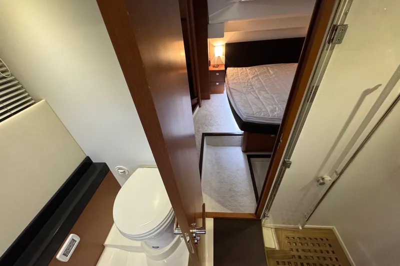  Yacht Photos Pics Interior of 2013 Prestige 500 yacht showing bathroom and bedroom with modern design.