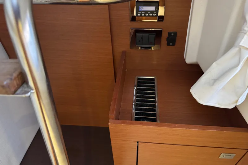  Yacht Photos Pics Interior of 2013 Prestige 500 yacht with control panel and wooden finish.