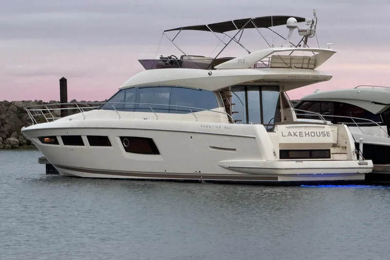 Yacht Photos Pics Luxurious 2013 Prestige 500 yacht named "Lakehouse" docked at sunset.