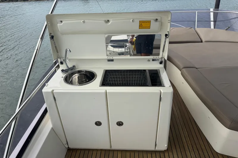  Yacht Photos Pics Outdoor kitchenette on 2013 Prestige 500 yacht with sink and grill.