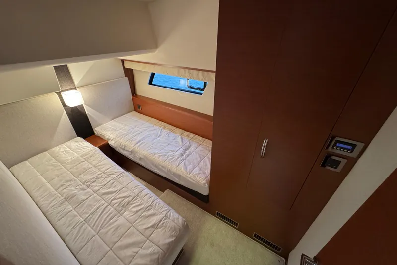  Yacht Photos Pics Twin cabin interior of 2013 Prestige 500 yacht with modern design and window view.