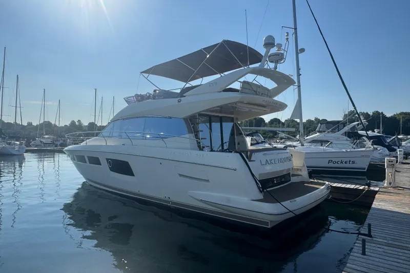  Yacht Photos Pics 2013 Prestige 500 yacht docked at marina under clear blue sky.