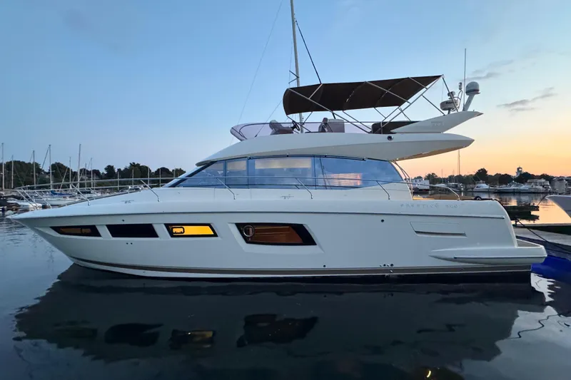  Yacht Photos Pics 2013 Prestige 500 yacht docked at sunset, featuring sleek design and modern amenities.