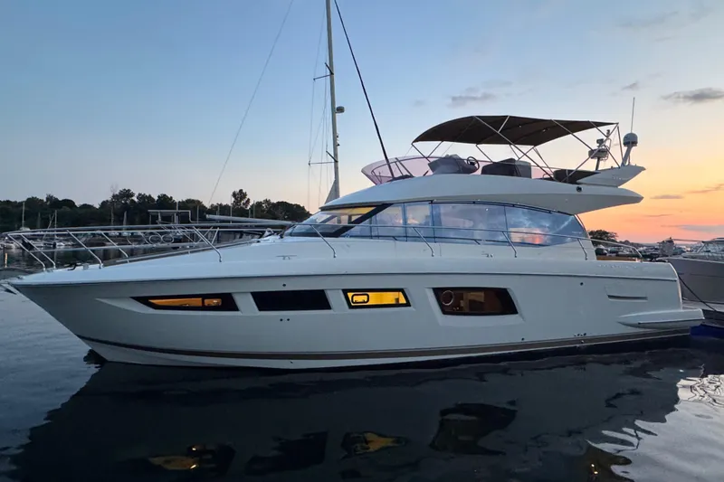  Yacht Photos Pics 2013 Prestige 500 yacht at sunset, docked in a serene marina setting.