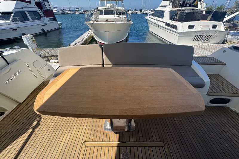  Yacht Photos Pics Prestige 500 yacht deck with wooden table and marina view, 2013 model.