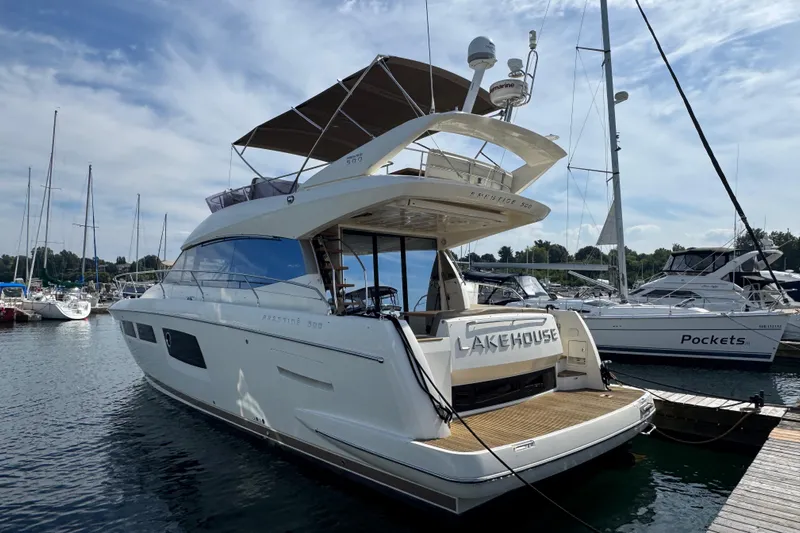  Yacht Photos Pics Luxury 2013 Prestige 500 yacht docked at marina under clear sky.