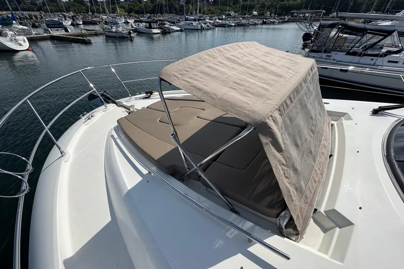  Yacht Photos Pics 2013 Prestige 500 yacht with sunshade, docked in a marina.