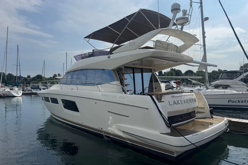  Yacht Photos Pics 2013 Prestige 500 yacht docked at marina, featuring sleek design and spacious deck.
