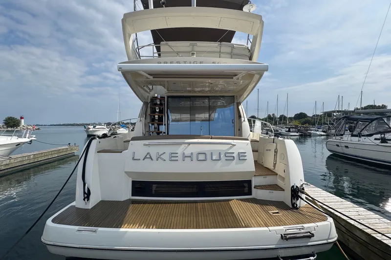  Yacht Photos Pics Luxury 2013 Prestige 500 yacht named "Lakehouse" docked at a marina.
